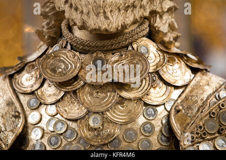 Detail of theatrical designer Debbie Rees Deacon's creation, a King Midas statue made out of one pound coins and other recycled material, at the British Ironwork Centre in Oswestry, Shropshire. Stock Photo
