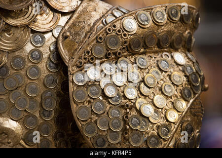 Detail of theatrical designer Debbie Rees Deacon's creation, a King Midas statue made out of one pound coins and other recycled material, at the British Ironwork Centre in Oswestry, Shropshire. Stock Photo