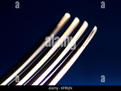 A macro shot of the prongs of a fork. Stock Photo