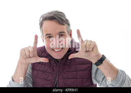 Gray-haired and middle-aged person is wearing a red vest. Isolated on white background. Stock Photo