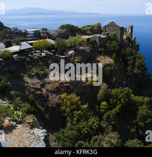 Corsica: ruins of the home of a noble family in the 16th century, the Sassa, overlooking Plage de Nonza, the black beach on the village of Nonza Stock Photo
