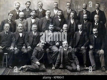 Group photograph of Federal Labour Party MPs elected to the Australian House of Representatives and Australian Senate at the inaugural 1901 election. From left to right: Back Row - Charles McDonald, George Pearce, Josiah Thomas, James Page, James Fowler, John Barrett, David O'Keefe. Middle row - David Watkins, Thomas Brown, King O'Malley, Hugh Mahon, William Higgs, Andrew Fisher, Hugh de Largie, Frederick Bamford. Front row - William Spence, Anderson Dawson, Gregor McGregor, Chris Watson, James Stewart, Lee Batchelor, James Ronald. Kneeling - Frank Tudor, Billy Hughes. Stock Photo