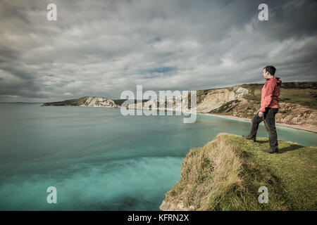 Walking along the coast and looking out to sea from a cliff top Stock Photo