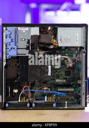 A PC personal computer tower showing the inside and internal areas including the motherboard, computer chips and power supply. Stock Photo