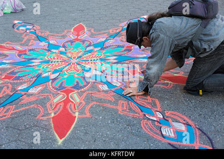 Joe Mangrum painting with sand in Washington Square Park in Greenwich Village, Manhattan, New York City/ Stock Photo