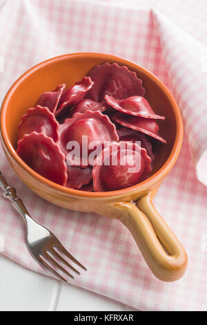 Tasty beetroot ravioli in bowl. Stock Photo