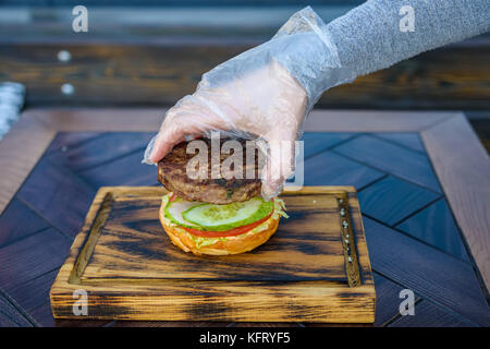 Preparing delicious hamburger Stock Photo