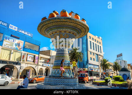 Cityscape with ceramic sculpture on road in city centre. Nabeul, Tunisia, North Africa Stock Photo