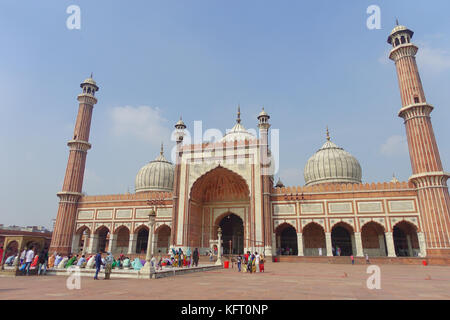 DELHI, INDIA - SEPTEMBER 27, 2017: Unidentified people walking in front of a beautiful Jama Masjid temple, this is the largest muslim mosque in India. Delhi, India Stock Photo