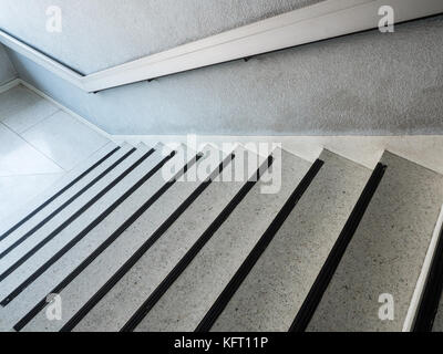 White marble pattern staircase with the metal handrail for use in case of fire,old office building in Thailand. Stock Photo