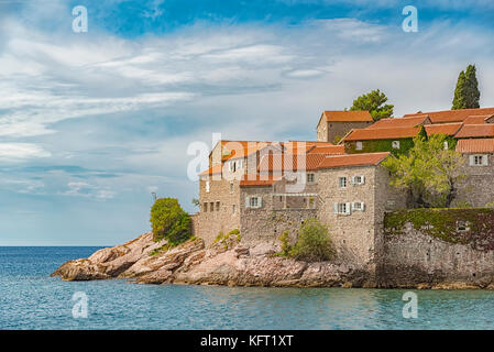 Sveti Stefan is a small islet and 5-star hotel resort on the Adriatic coast of Montenegro Not far from Budva. Stock Photo