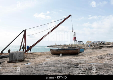 Fishing boat and lifting gear on Portland Bill Stock Photo