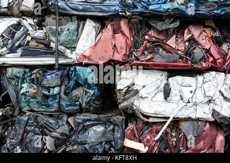 Cars in junkyard,  pressed and packed for recycling.