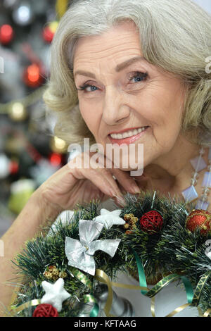 Portrait of senior woman preparing for Christmas Stock Photo