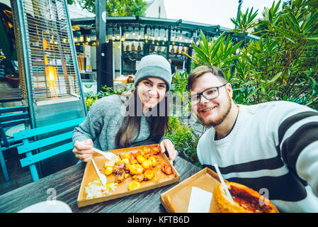 couple eating in cafe outside Stock Photo