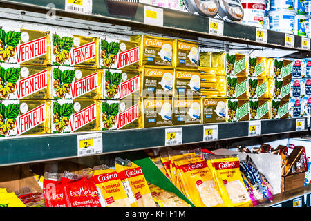Packs of butter on shop shelf - France. Stock Photo