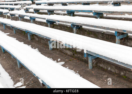 wooden bench under the snow Stock Photo