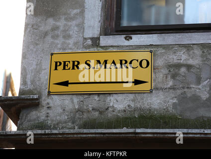 Big signpost with directions to go to St. Mark's Square in Venice in Italy Stock Photo