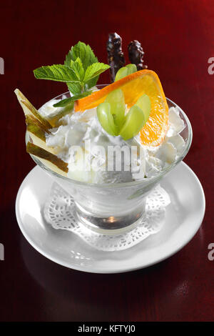 Ice cream in a glass cube with fruits Stock Photo