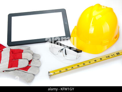 Builder architect using electronic tablet for blueprints Stock Photo