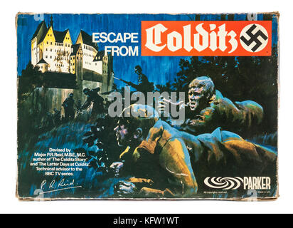 Original 1970's version of the 'Escape from Colditz' board game featuring a German swastika on the box. On later editions, the swastika was replaced w Stock Photo