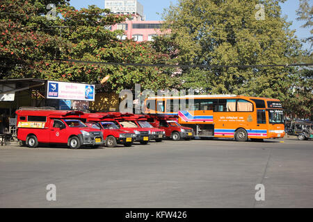 CHIANGMAI, THAILAND -JANUARY 10 2016: Red taxi Chiang Mai, For Passenger from Bus Station to City Center. Photo at Chiangmai bus station, Thailand. Stock Photo