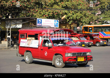 CHIANGMAI, THAILAND -JANUARY 10 2016: Red taxi Chiang Mai, For Passenger from Bus Station to City Center. Photo at Chiangmai bus station, Thailand. Stock Photo