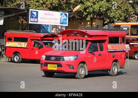 CHIANGMAI, THAILAND -JANUARY 10 2016: Red taxi Chiang Mai, For Passenger from Bus Station to City Center. Photo at Chiangmai bus station, Thailand. Stock Photo