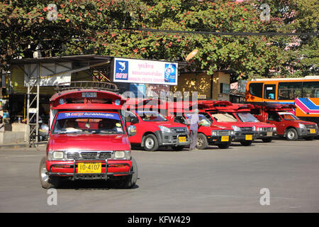 CHIANGMAI, THAILAND -JANUARY 10 2016: Red taxi Chiang Mai, For Passenger from Bus Station to City Center. Photo at Chiangmai bus station, Thailand. Stock Photo