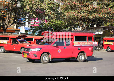 CHIANGMAI, THAILAND -JANUARY 10 2016: Red taxi Chiang Mai, For Passenger from Bus Station to City Center. Photo at Chiangmai bus station, Thailand. Stock Photo