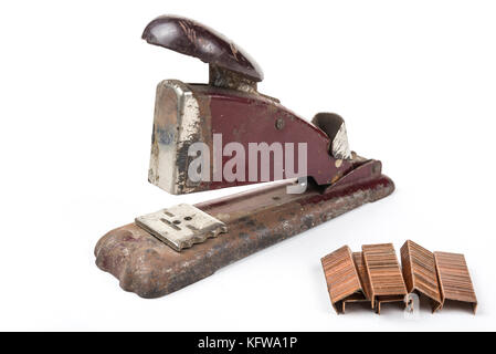 Old vintage retro metal stapler with staples isolated on white background Stock Photo
