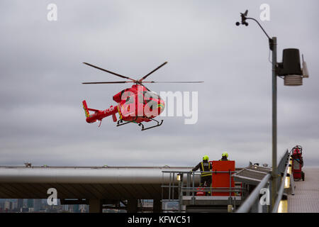 London Air Ambulance lands on the helipad of the Royal London Hospital Stock Photo