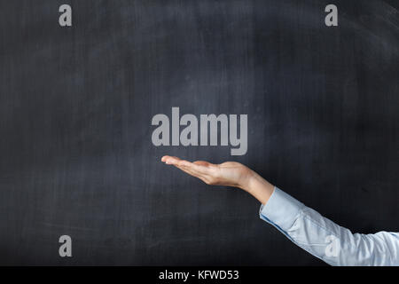 Empty blackboard with hand and copyspace Stock Photo