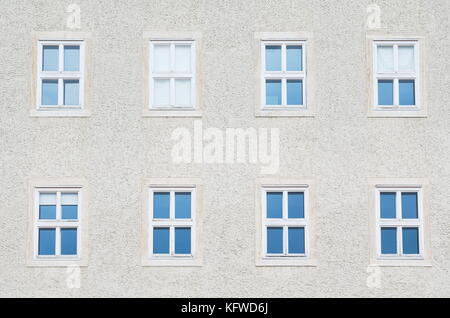 Eight Symmetrical Windows on the Building Closeup Stock Photo