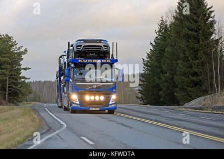 SALO, FINLAND - DECEMBER 11, 2015: Volvo FM car carrier of Kurbads hauls new cars. The Finnish automotive industry estimates that a total of 109,000 n Stock Photo