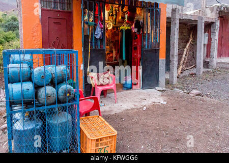 Megdaz, Morocco, 15 October, 2017: A local shop in with Berber man, Megdaz a traditional Berber village situated in high Atlas mountains, built on mou Stock Photo