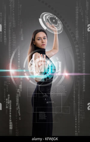 Futuristic woman working with virtual touchscreens Stock Photo