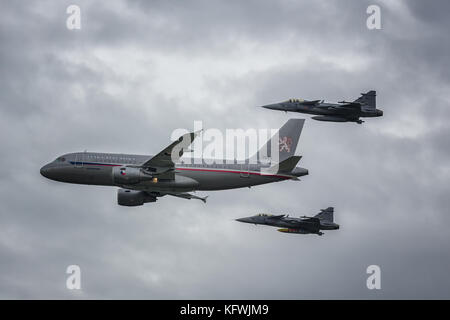 Czech Goverment aircraft escorted by two JAS 39 Gripens from the czech air force Stock Photo