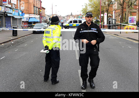 Birmingham, UK. 1st Nov, 2017.  An officer from West Midlands Police forensic team, at the scene of an incident involving gunfire, outside the Spices Takeaway Restaurant on the Soho Road in Handsworth.  West Midlands Ambulance Service were called out the previous evening at around 10.50 pm, responding to a reported assault outside the takeaway. Part of Soho Road has been closed for over 12 hours whilst police carry out a serious of searches outside of the restaurant. Credit: Kevin Hayes/Alamy Live News Stock Photo