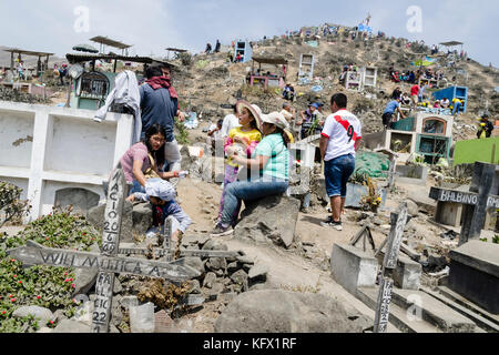 Celebration of All Saints' Day in a Lima Cemetery, Peru / Día de los Muertos en el Cementerio de Villa María del Triunfo, Lima, Peru. Stock Photo