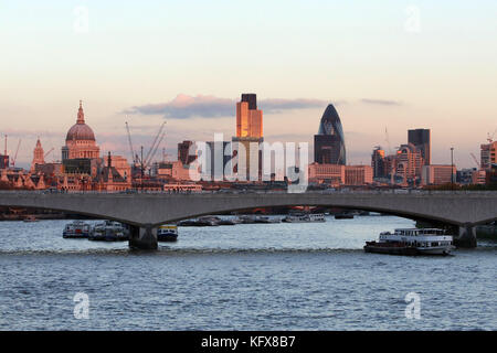 London City Skyline in Pink Sunlight. River Thames looking East to The Gherkin and St Paul's Cathedral. 2007 Stock Photo