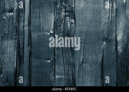 Dark blue tint wood texture. Painted rough lumber board background. Stock Photo