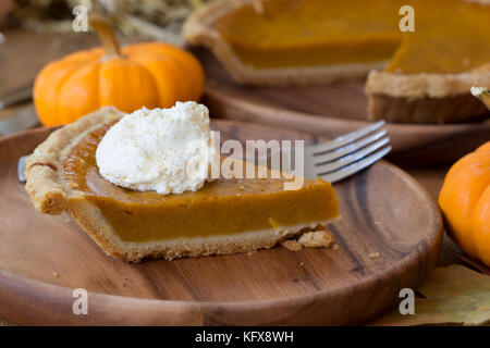 Slice of pumpkin pie with whipped cream toppingcloseup Stock Photo