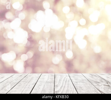 Christmas background with light spots and bokeh with empty table for your montage Stock Photo