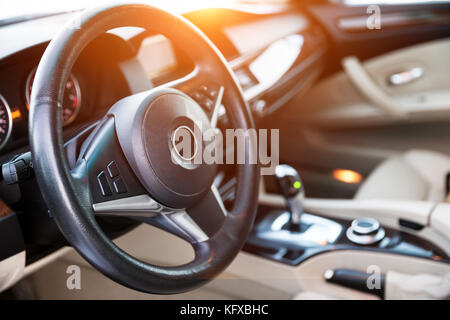 Interior view of car with luxery beige salon with sunlight Stock Photo