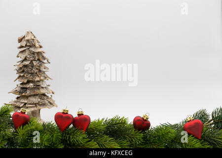 Christmas border isolated on white background with christmas balls in red hearts Stock Photo