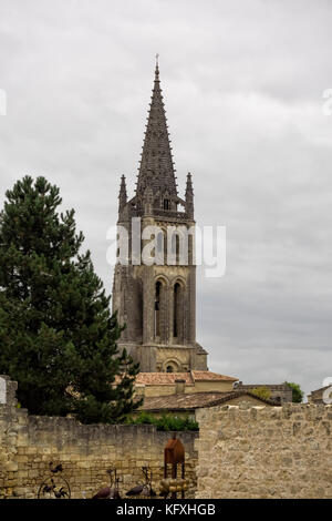 SAINT-EMILION, FRANCE - SEPTEMBER 07, 2017:  The Bell Tower of the Monolithic Church seen above the Town Walls Stock Photo