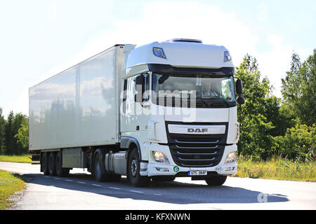 SALO, FINLAND - JULY 24, 2015: New white DAF XF semi truck on summer road in Salo. PACCAR reports strong revenues and net income for the Q3 of 2015. Stock Photo