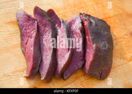 Minke whale meat (Balaenoptera acutorostrata), Reine, Lofoten, Norway Stock Photo