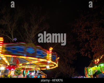 Fairground rides at a public firework display at Brookdale Park in Manchester Stock Photo